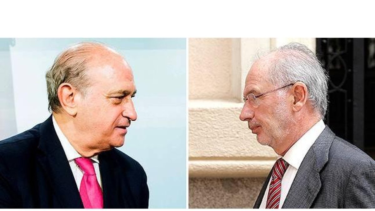 Jorge Fernández Díaz, ministro del Interior, y Rodrigo Rato, exvicepresidente del Gobierno y exministro de Economía.-JOSÉ LUIS ROCA