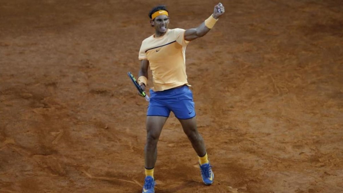 Nadal celebra con rabia su victoria frente al estadounidense Querrey, que lo sitúa en cuartos-FRANCISCO SECO / AP