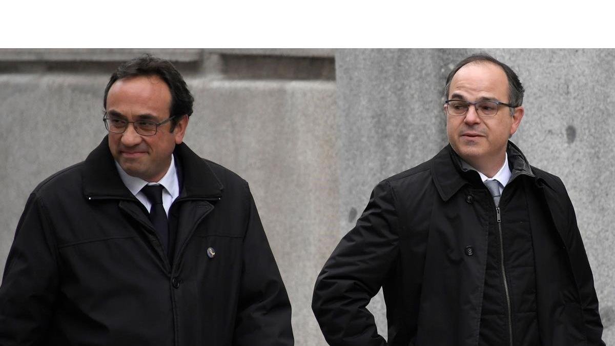 Jordi Turull (a la derecha), con Josep Rull, el pasado marzo, cuando fueron a declarar al Tribunal Supremo. /-AFP