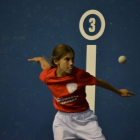 Imagen de una participante infantil de pelota mano femenina. EM